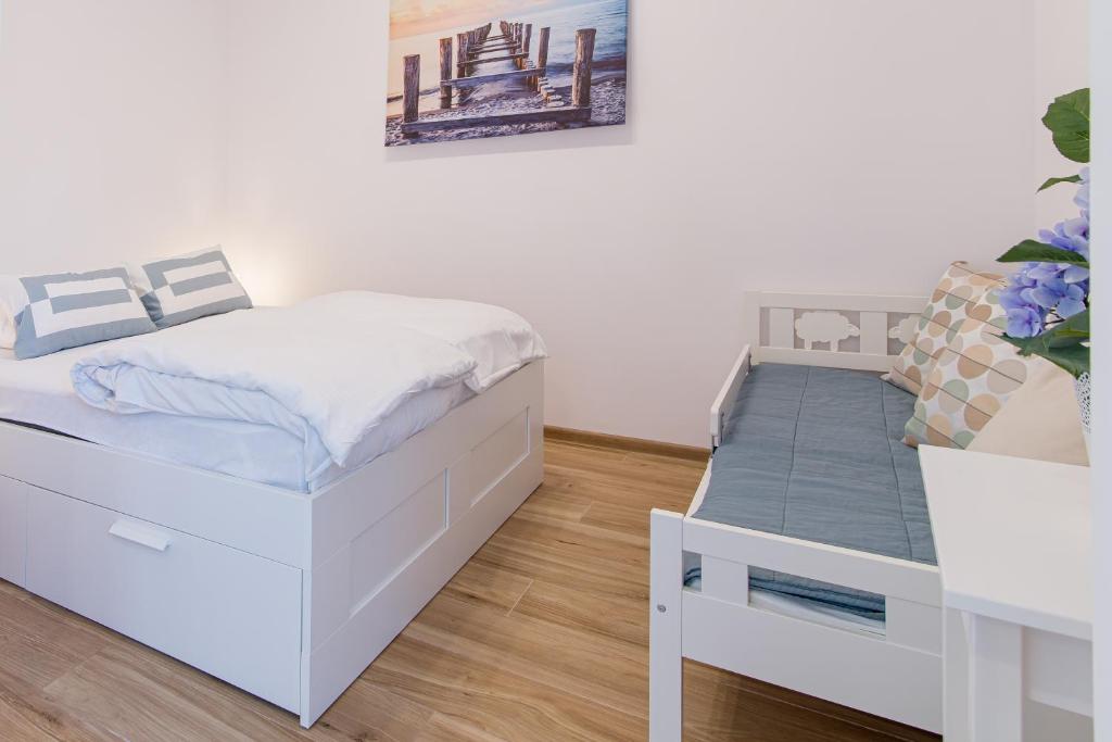 Posteľ alebo postele v izbe v ubytovaní Praia Apartments - 200m do Plaży Orłowo - Parking - Apartament Laguna