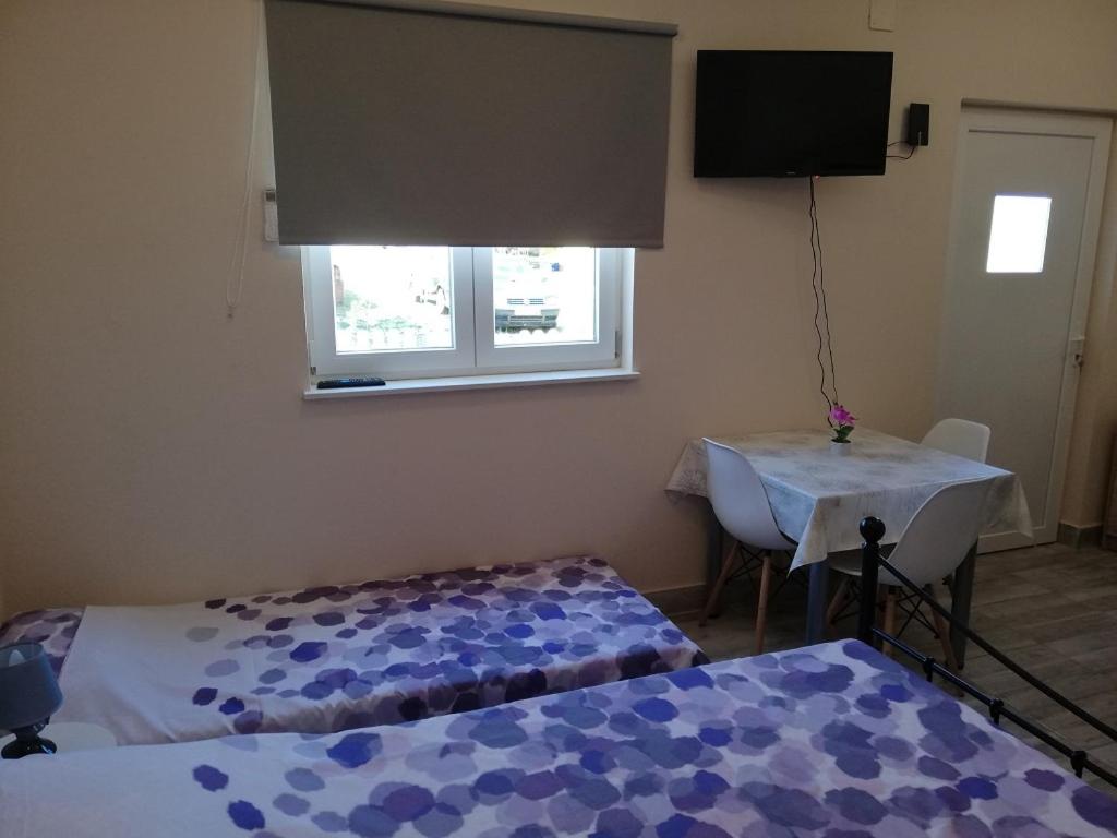 Postel nebo postele na pokoji v ubytování Studio Apartment Palmira