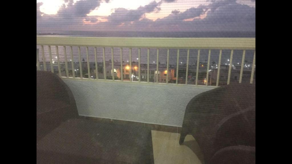 a balcony with a view of a city at Al-Madina Tower Apartments in Marsa Matruh