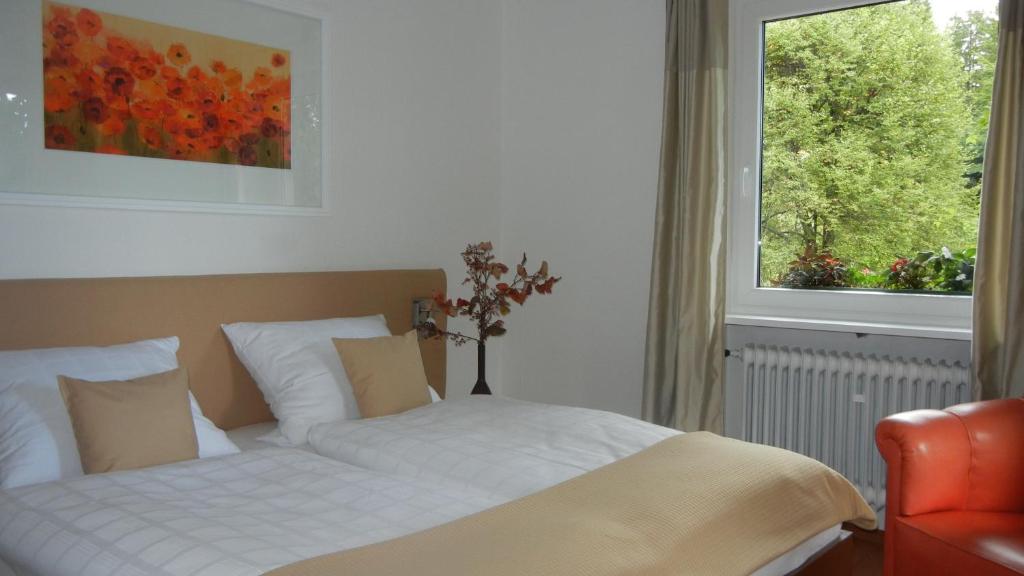 Postel nebo postele na pokoji v ubytování Hotel Barbara