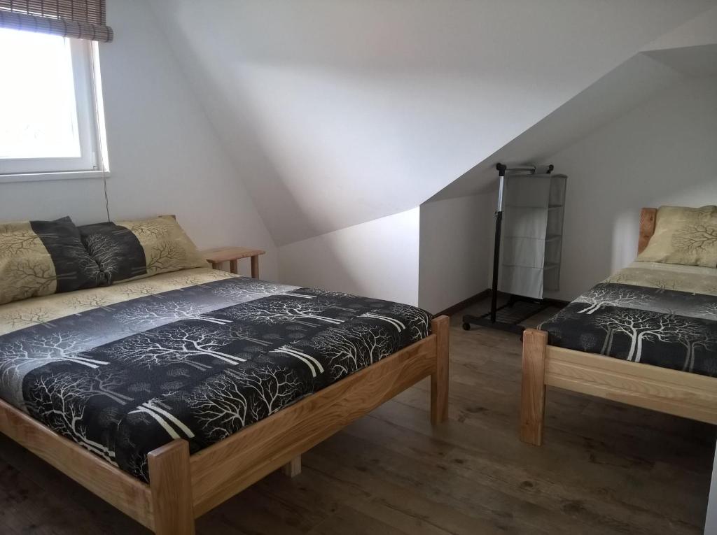 Postel nebo postele na pokoji v ubytování Apartmani Mimi