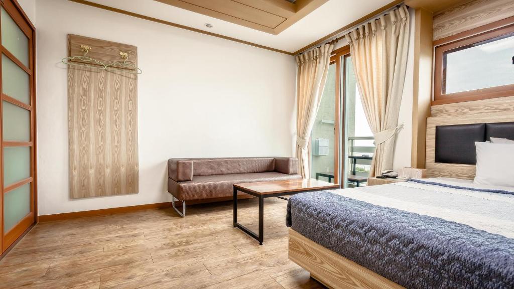Postel nebo postele na pokoji v ubytování Dawoo Resortel
