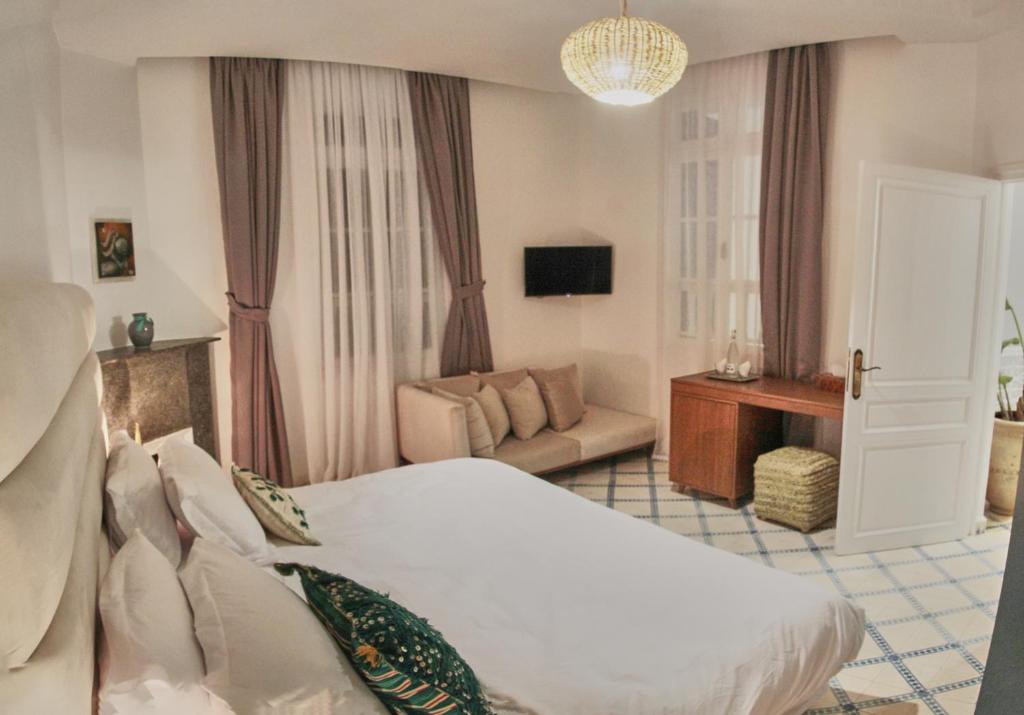 Postel nebo postele na pokoji v ubytování Riad Borj El Baroud