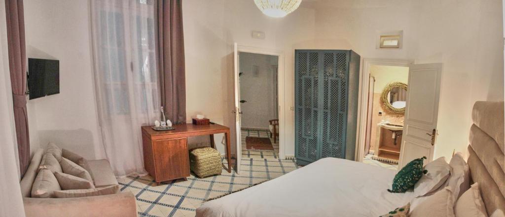 Postel nebo postele na pokoji v ubytování Riad Borj El Baroud