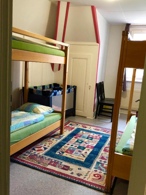 Letto o letti in una camera di Auberge Pour Tous