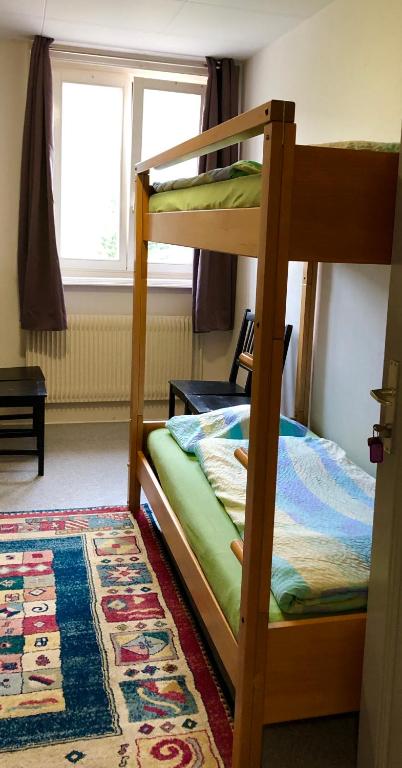 Letto o letti in una camera di Auberge Pour Tous