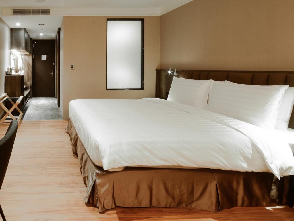 Postel nebo postele na pokoji v ubytování Lai Hotel