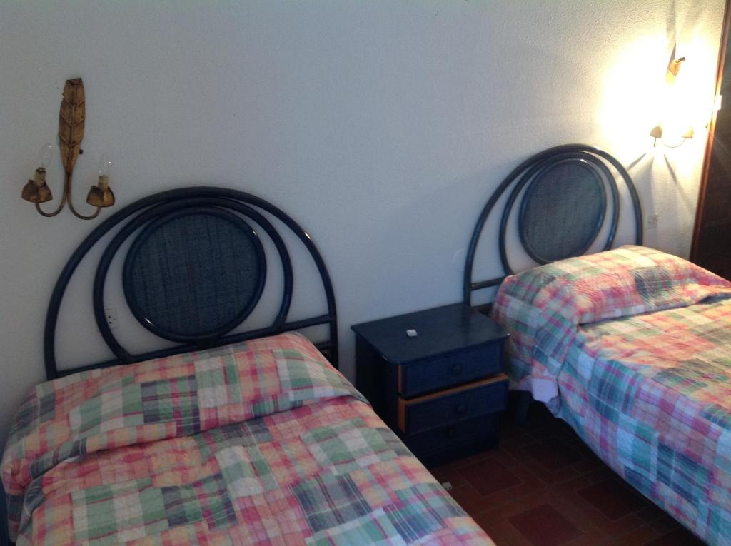 Postel nebo postele na pokoji v ubytování Apartament Turístic Alhambra