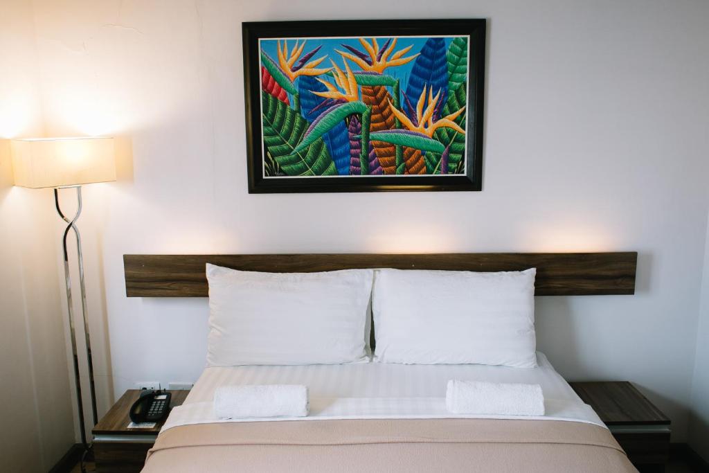 Postel nebo postele na pokoji v ubytování Leope Hotel