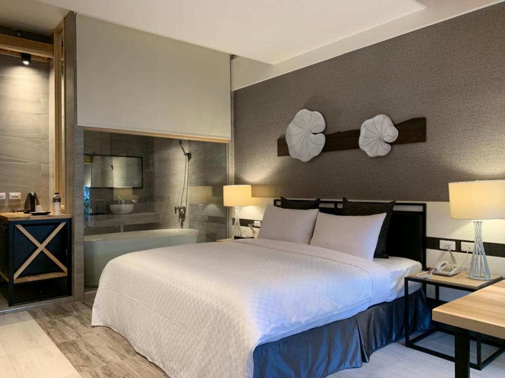 Postel nebo postele na pokoji v ubytování Roppongi Motel - JianHua