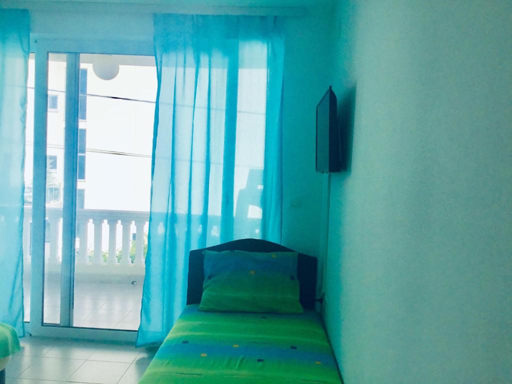 Postel nebo postele na pokoji v ubytování DK Apartmani