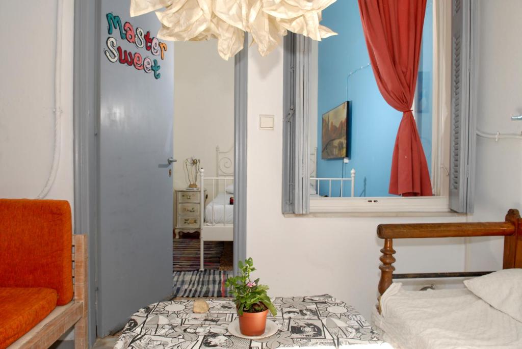 a bedroom with a bed and a mirror at Chameleon Youth Hostel in Athens