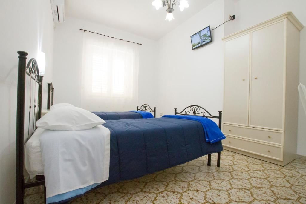Postel nebo postele na pokoji v ubytování Le Maschere B&B