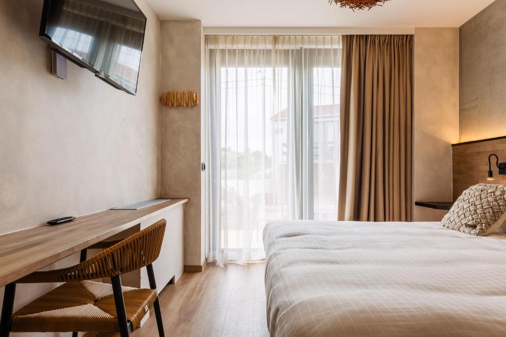 Postel nebo postele na pokoji v ubytování C-Hotels Zeegalm