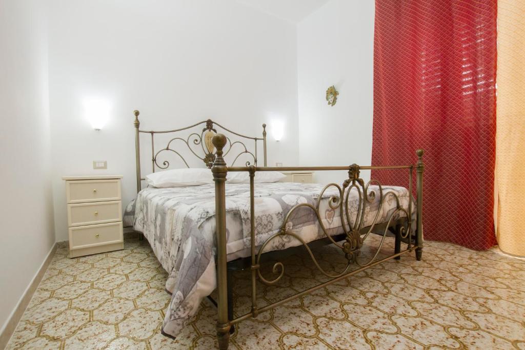 Postel nebo postele na pokoji v ubytování Le Maschere B&B