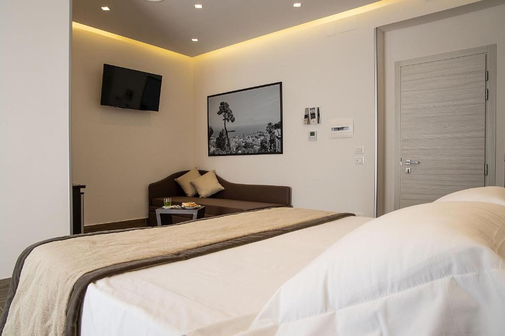 Postel nebo postele na pokoji v ubytování Hotel Palazzo Argenta