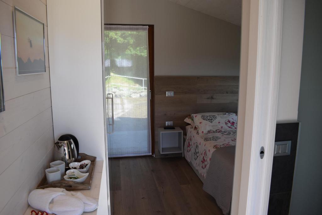 Postel nebo postele na pokoji v ubytování 2 CUORI E UN B&B