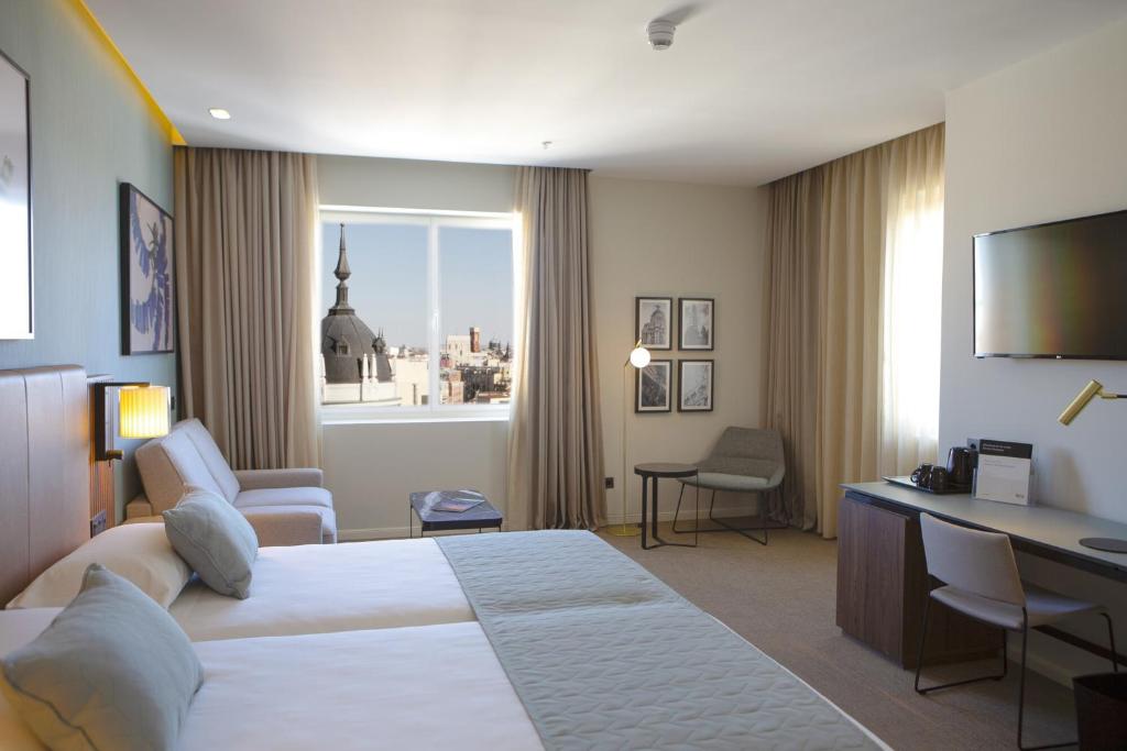 Riu Plaza Españaにあるベッド
