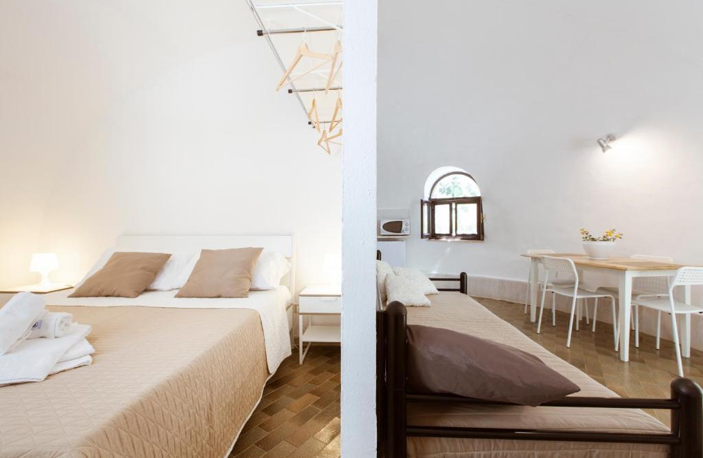 Posteľ alebo postele v izbe v ubytovaní Residence Guidaloca