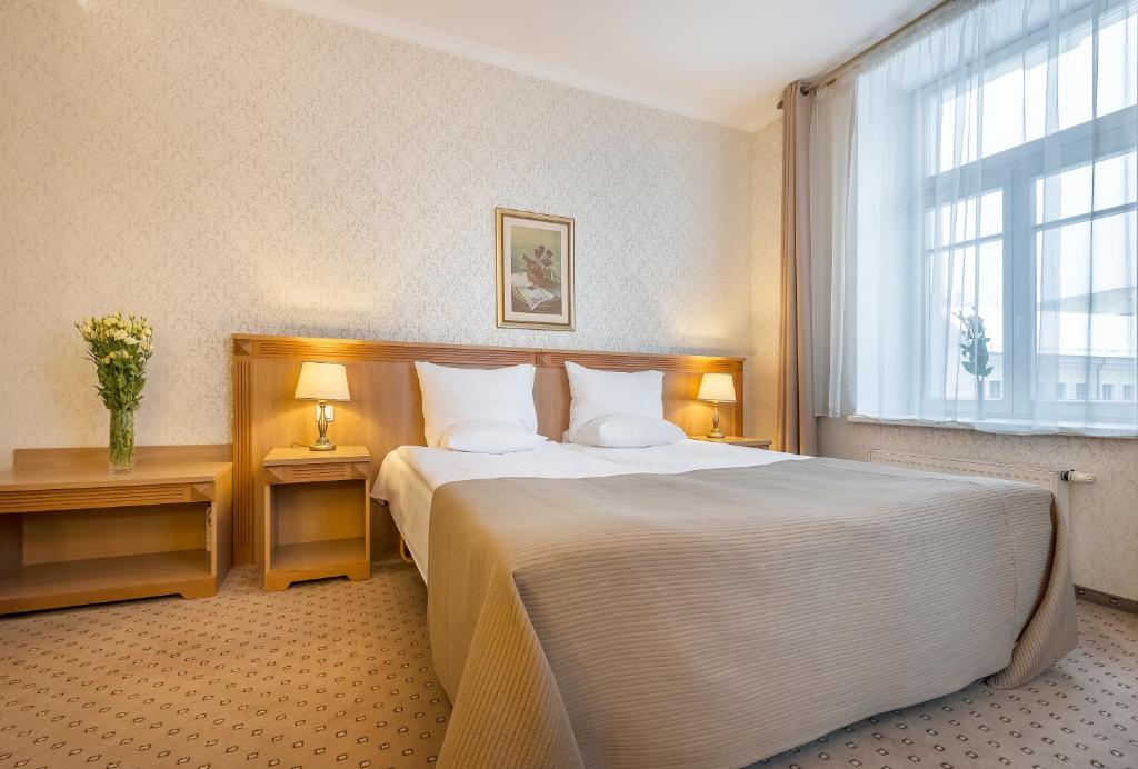 Postel nebo postele na pokoji v ubytování Artis Centrum Hotels