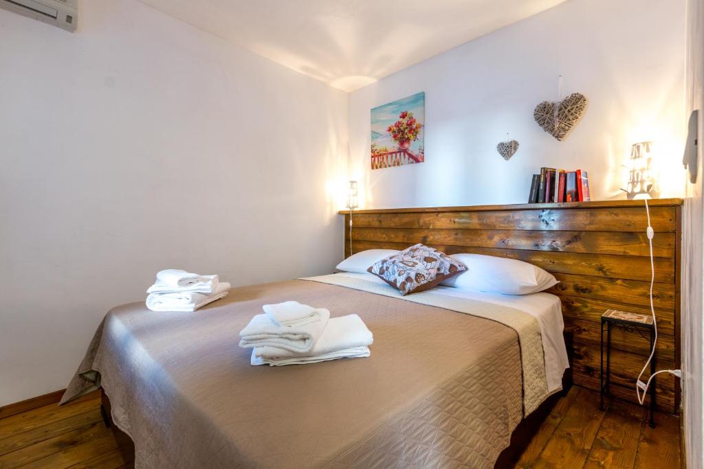 Postel nebo postele na pokoji v ubytování Palazzo Refolo