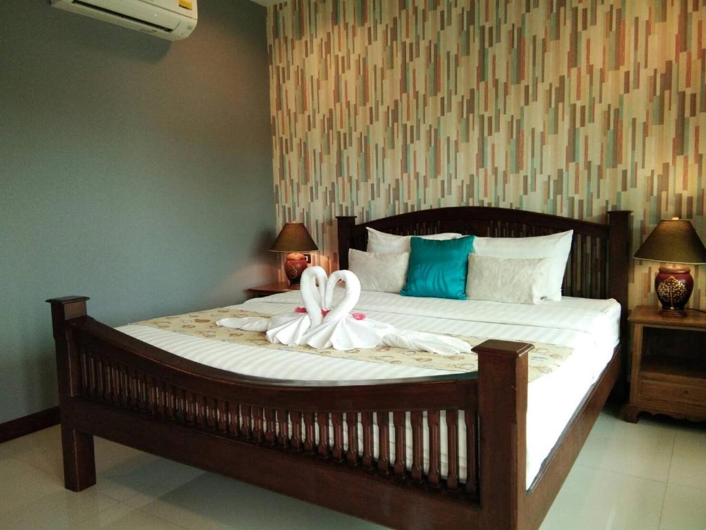 Postel nebo postele na pokoji v ubytování Scent of Sukhothai Resort