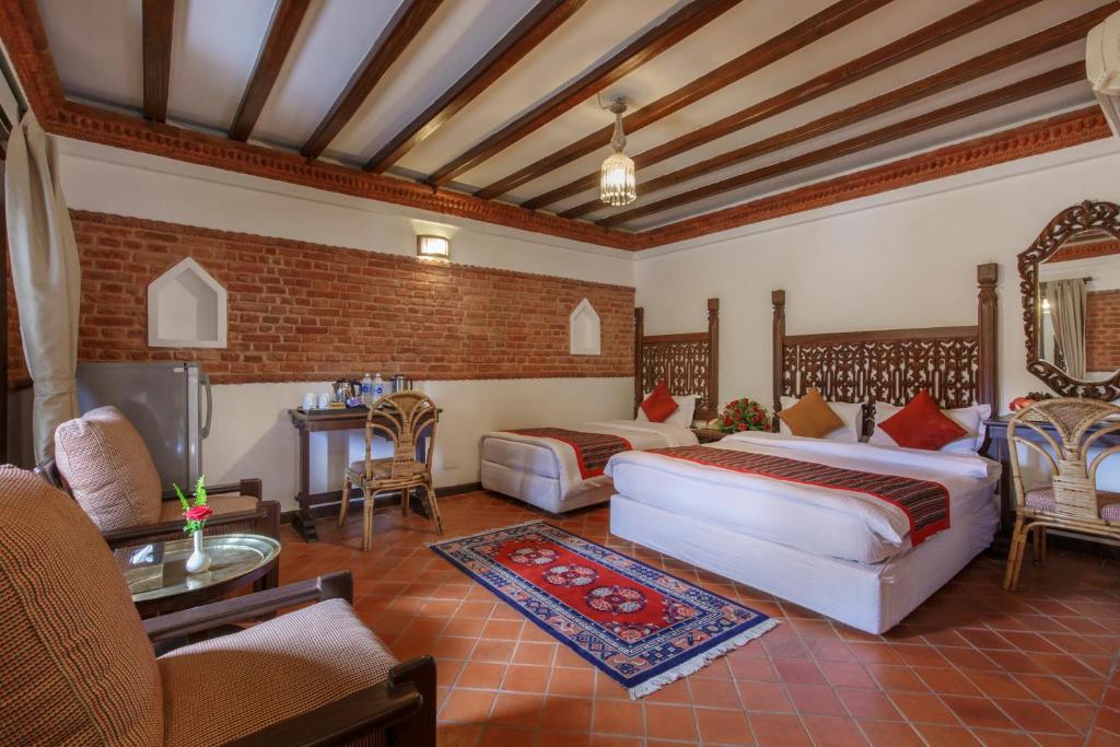Postel nebo postele na pokoji v ubytování Hotel Manaslu