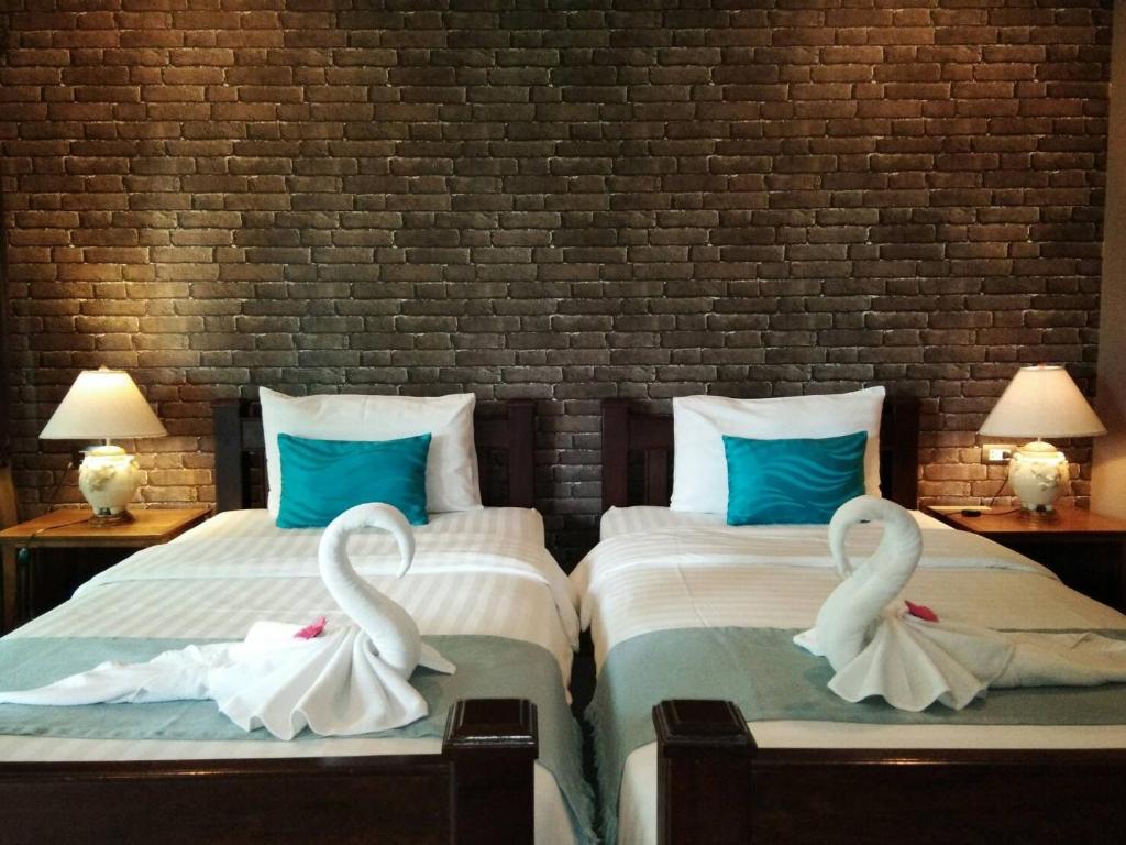 Postel nebo postele na pokoji v ubytování Scent of Sukhothai Resort