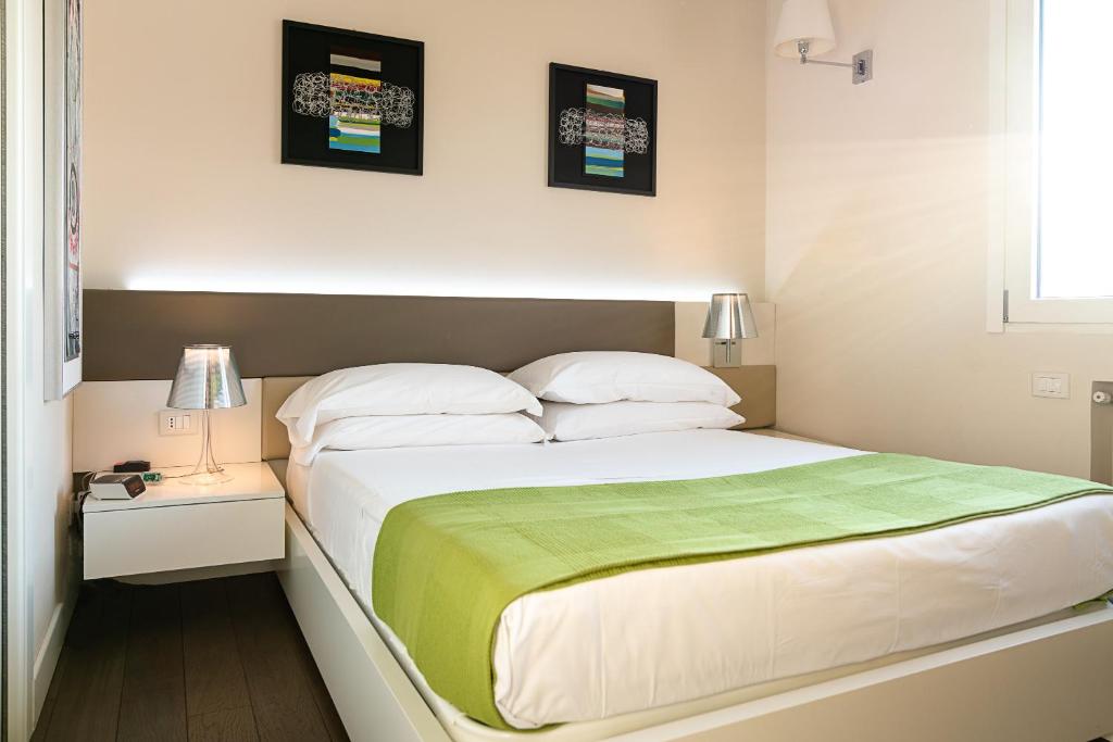 Letto o letti in una camera di B&B Pellicano Guest House
