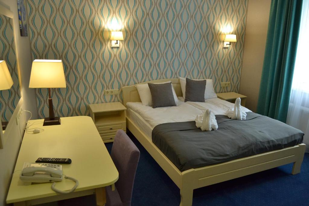 Postel nebo postele na pokoji v ubytování Hotel Ajur