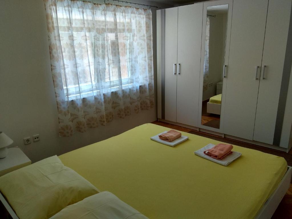 Posteľ alebo postele v izbe v ubytovaní Apartments Grkinić