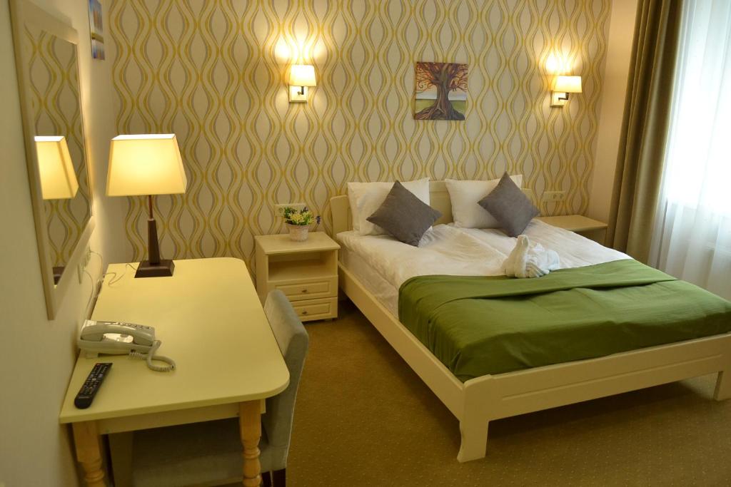 Postel nebo postele na pokoji v ubytování Hotel Ajur