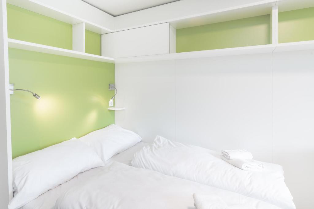 Postel nebo postele na pokoji v ubytování myNext - Hotel Leo