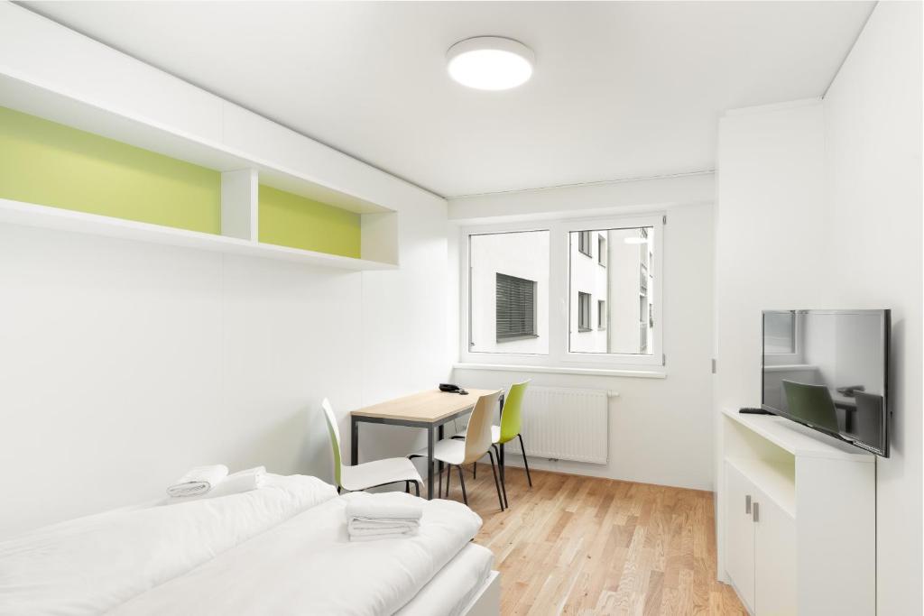 Postel nebo postele na pokoji v ubytování myNext - Hotel Leo
