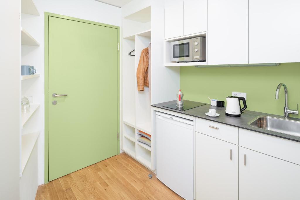 Kuchyň nebo kuchyňský kout v ubytování myNext - Hotel Leo