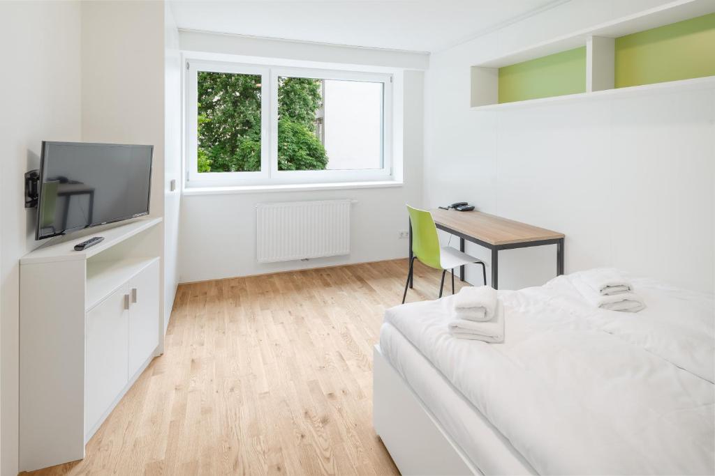 TV a/nebo společenská místnost v ubytování myNext - Hotel Leo
