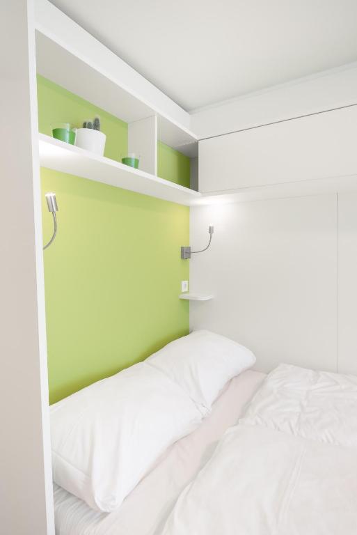 Postel nebo postele na pokoji v ubytování myNext - Hotel Leo
