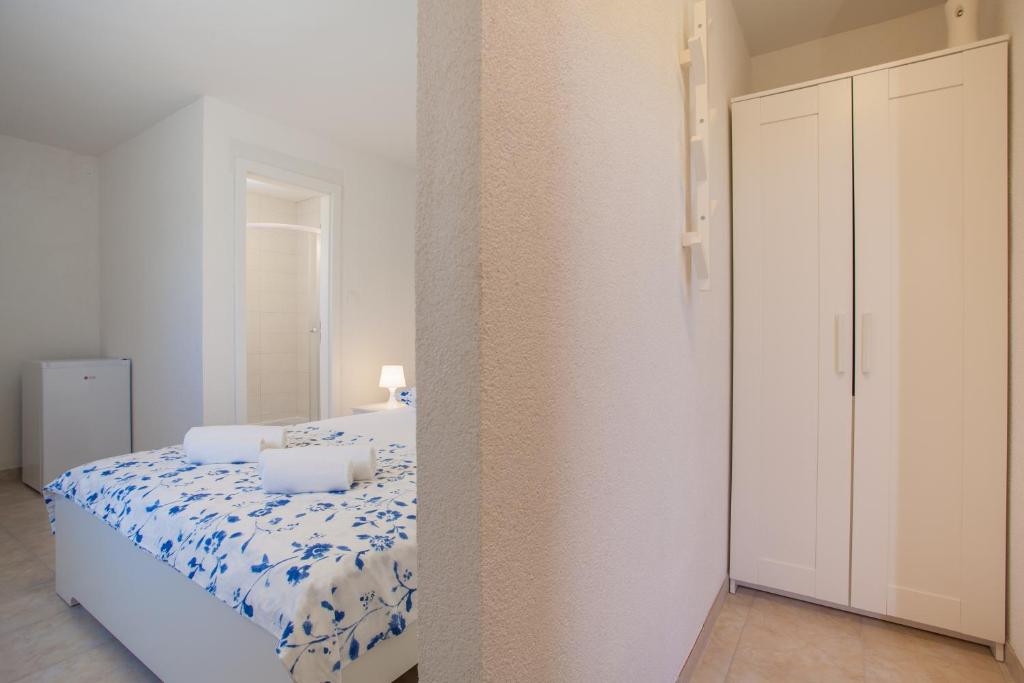 Postel nebo postele na pokoji v ubytování Apartments Dandić