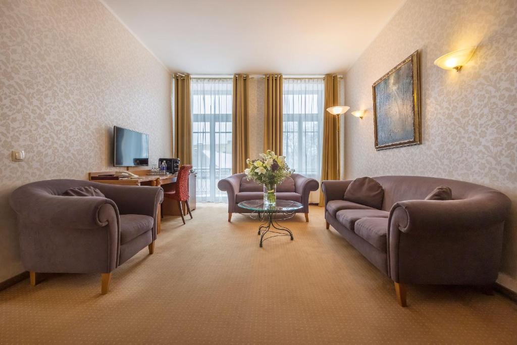 TV a/nebo společenská místnost v ubytování Artis Centrum Hotels