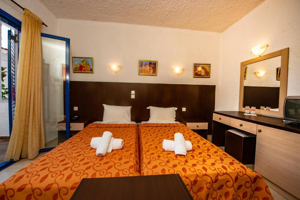 Postel nebo postele na pokoji v ubytování Hotel Elena Syvota