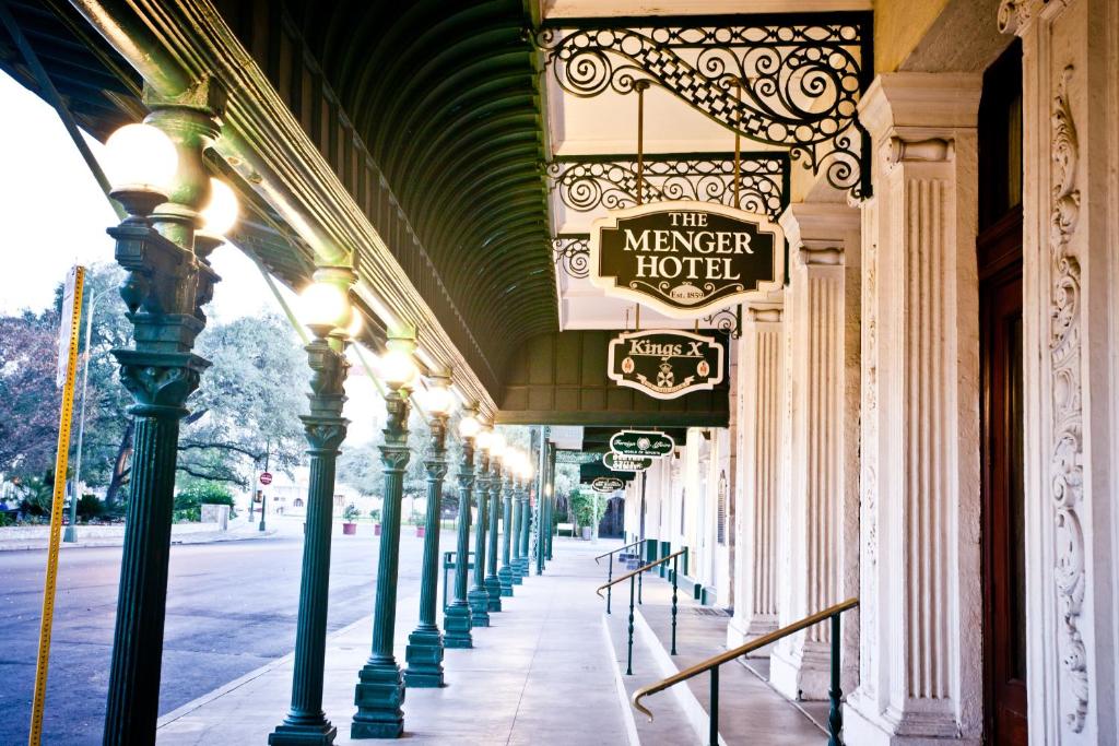 a building with avelt hotel sign on a street at Menger Hotel in San Antonio