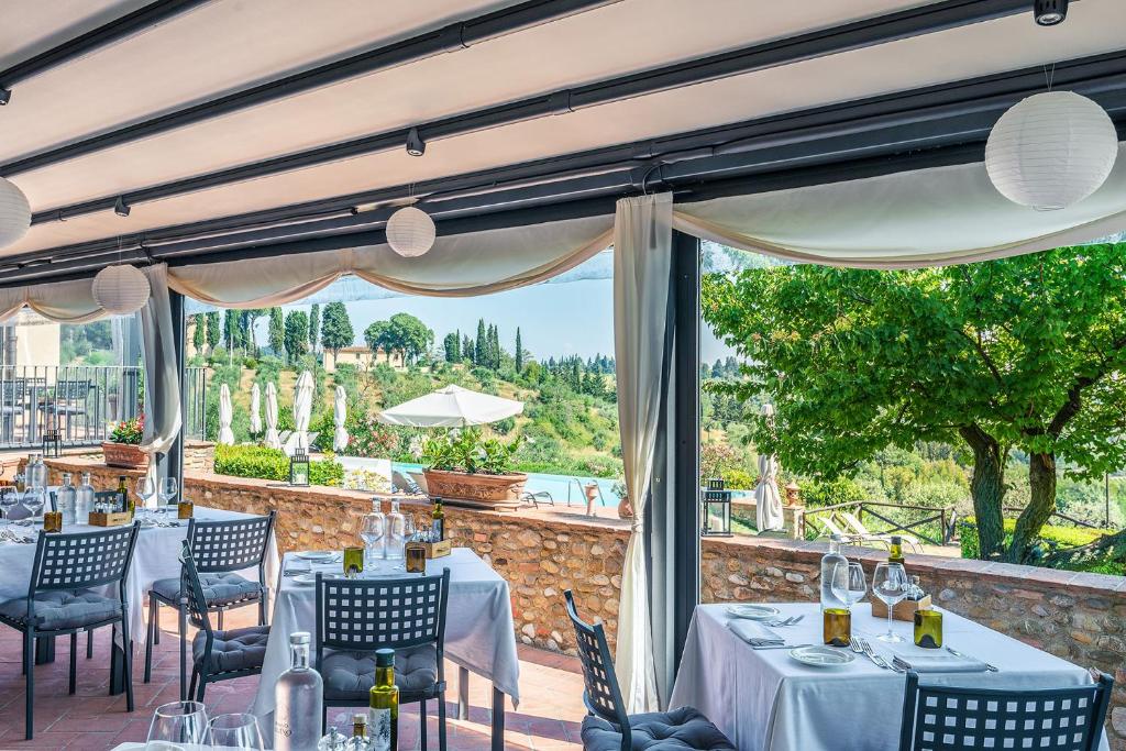 Reštaurácia alebo iné gastronomické zariadenie v ubytovaní Borgo Divino