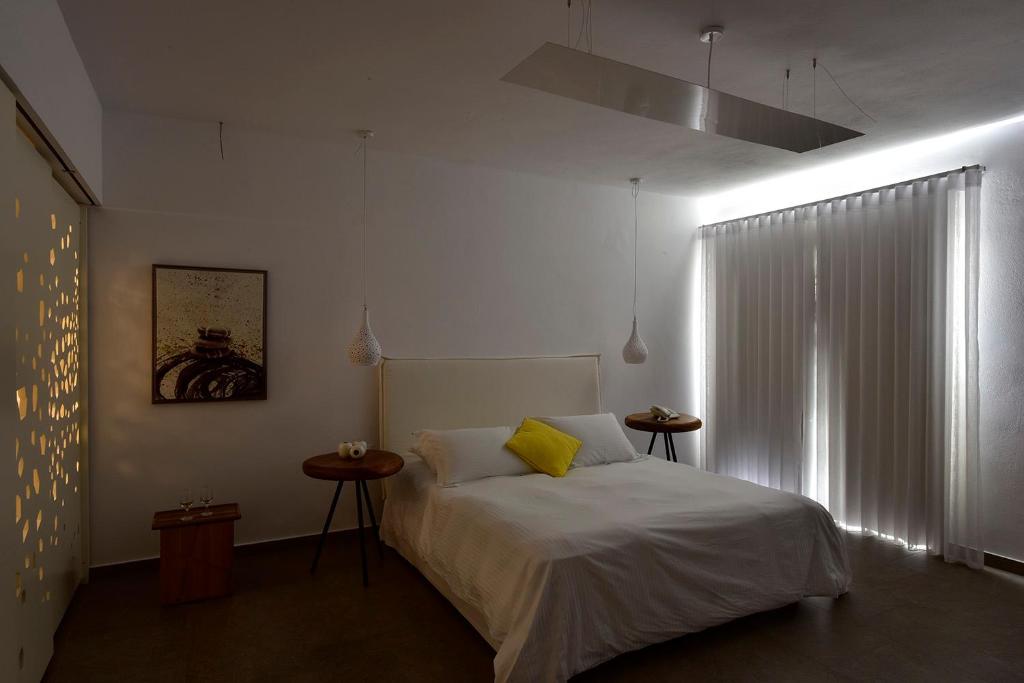 Postel nebo postele na pokoji v ubytování Margie Mykonos Hotel