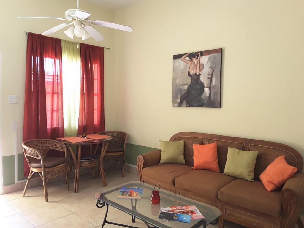 a living room with a couch and a table at SXM Spotters Paradise in Lowlands