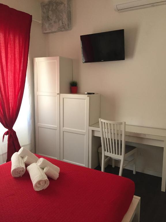 A bed or beds in a room at De Guestibus