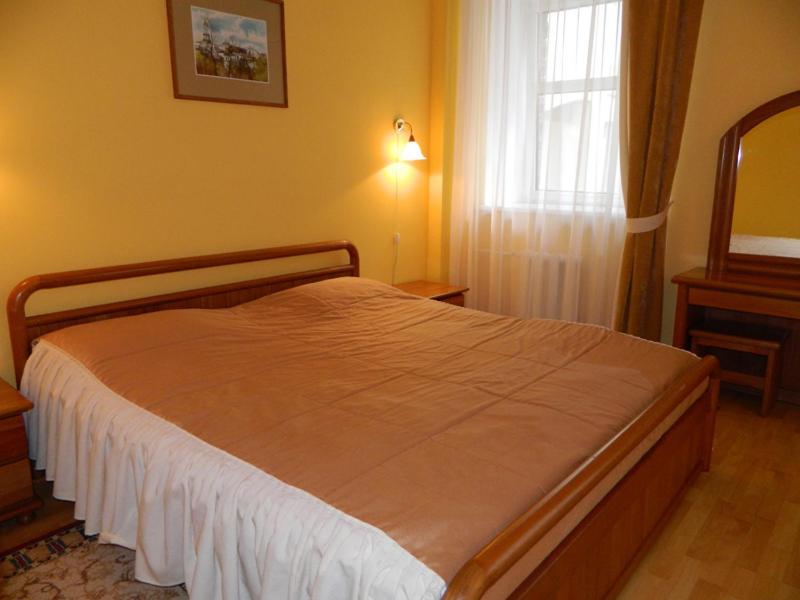 Postel nebo postele na pokoji v ubytování Hotel Obolon