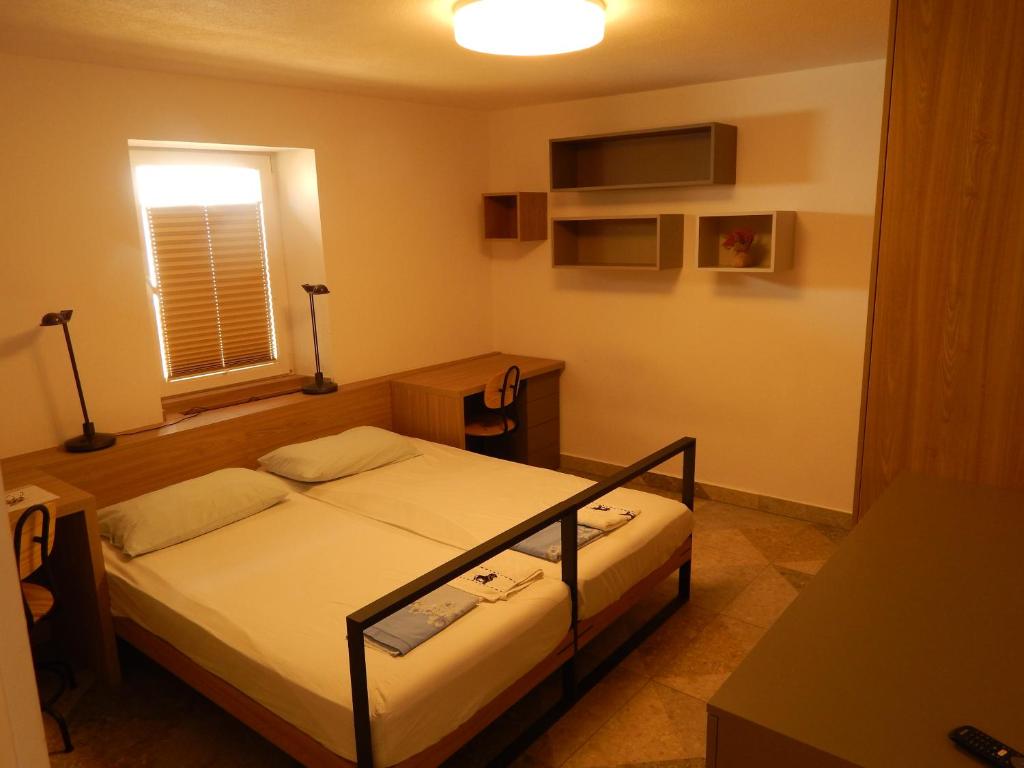 Postel nebo postele na pokoji v ubytování Casa Riccobon 5