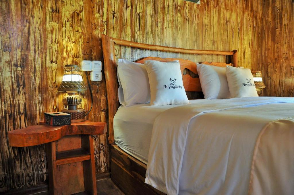 Postel nebo postele na pokoji v ubytování Aryaginata Cliff Cottages
