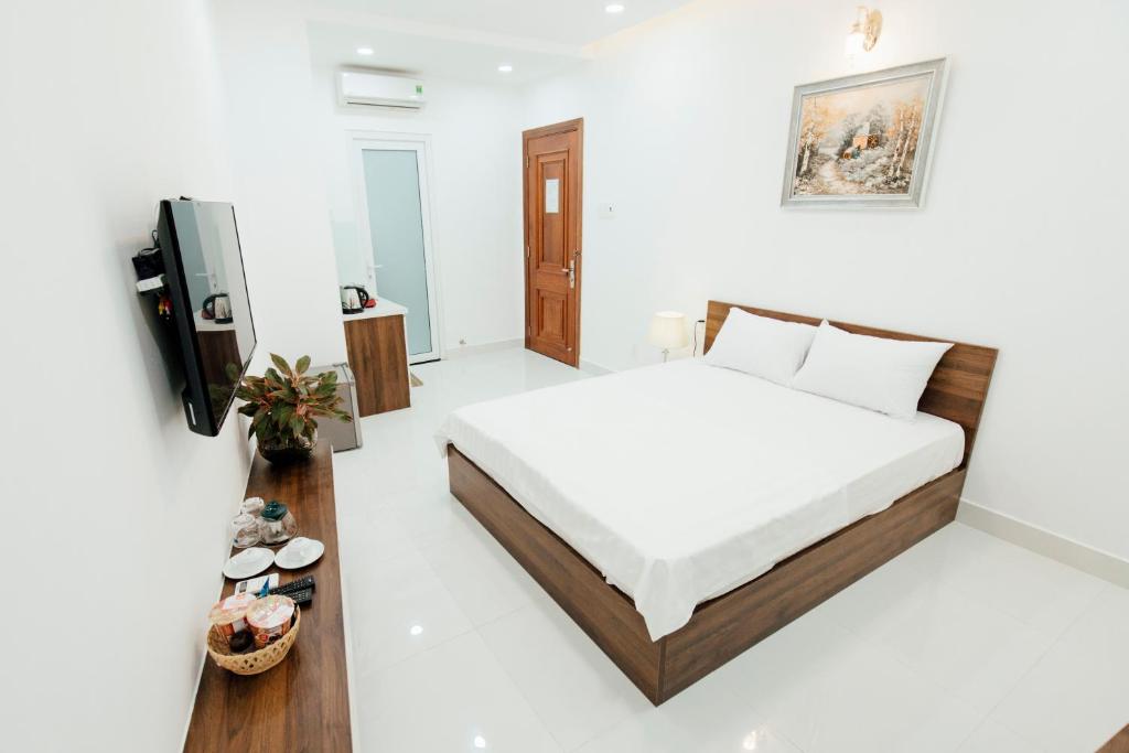 Giường trong phòng chung tại Aladdin Hotel