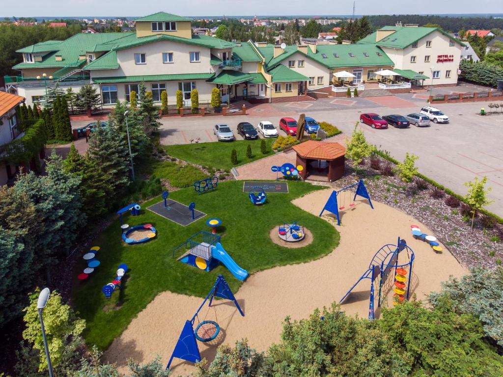 an aerial view of a park with a playground at Sajmino Family House in Ostróda